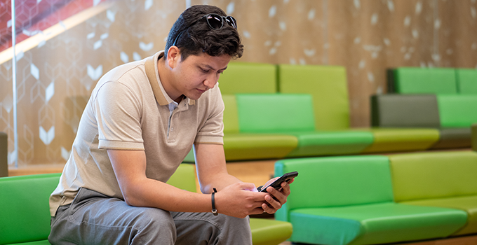 image of student with mobile phone