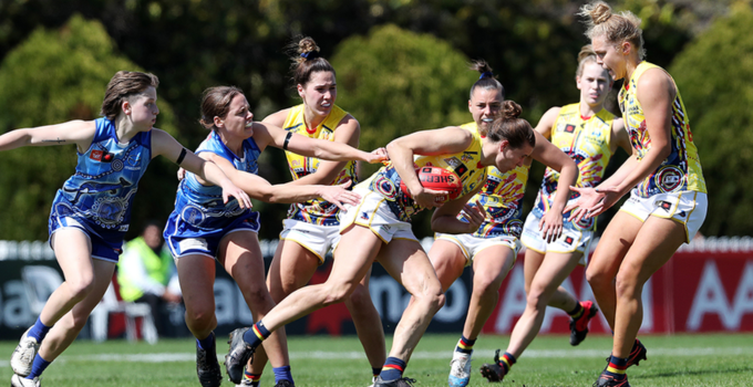 AFLW game depicting multiple players vying for the ball.