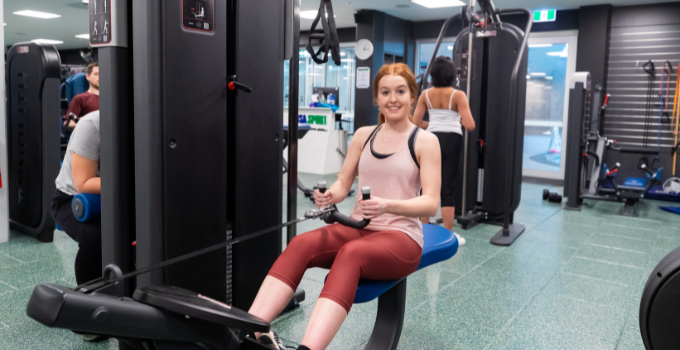 Image of female student working out at a UniSA gym.