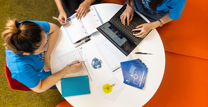 rds eye view of three Study Help PALS studying on a circular table