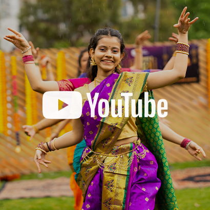 Image of female dancers dressed in traditional Indian outfits at Diwali event, with YouTube logo as an overlay on the image