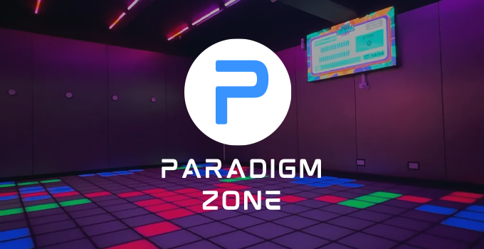 Paradigm Zone
Image of a lit-up floor with different coloured tiles and a scoreboard screen on the wall