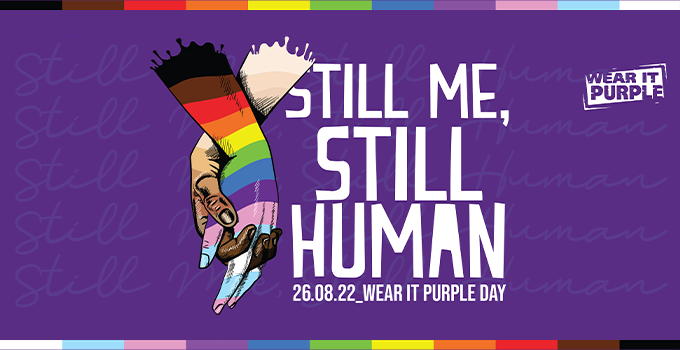 "Still Me, Still Human" wear it purple day banner. 