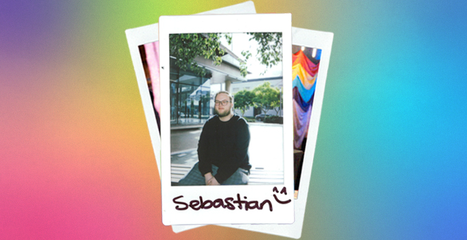 A polaroid photo of Sebastian against a rainbow background