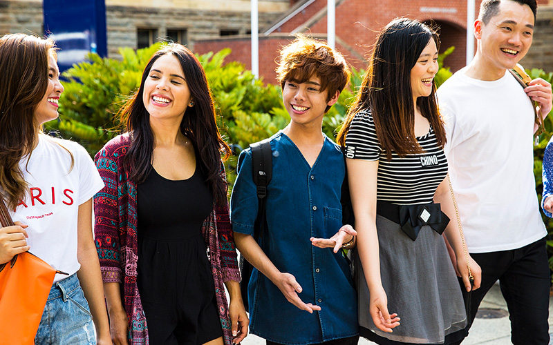 students smiling on a campus tour