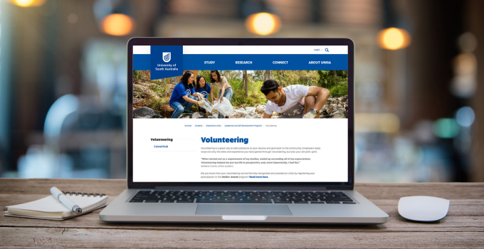 Image of a laptop with the UniSA volunteering webpage on the screen.