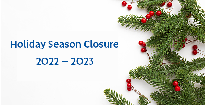 Christmas ornaments with the text "holiday season closure".