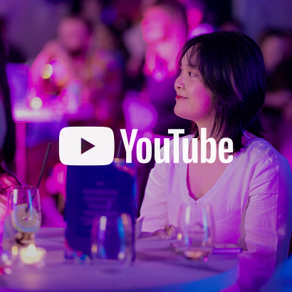 Image of a female student sitting at a table at the OPAL Gala, with YouTube logo as an overlay on the image