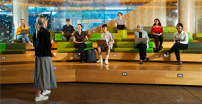 Image of students listening to a presentation in the Jeffrey Smart Forum